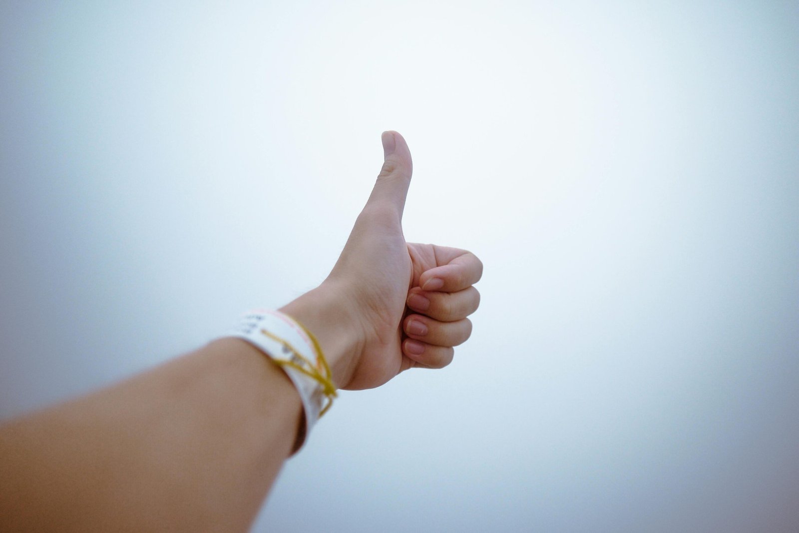pexels-photo-193821-193821 A hand giving a thumbs up gesture symbolizes approval and positivity.