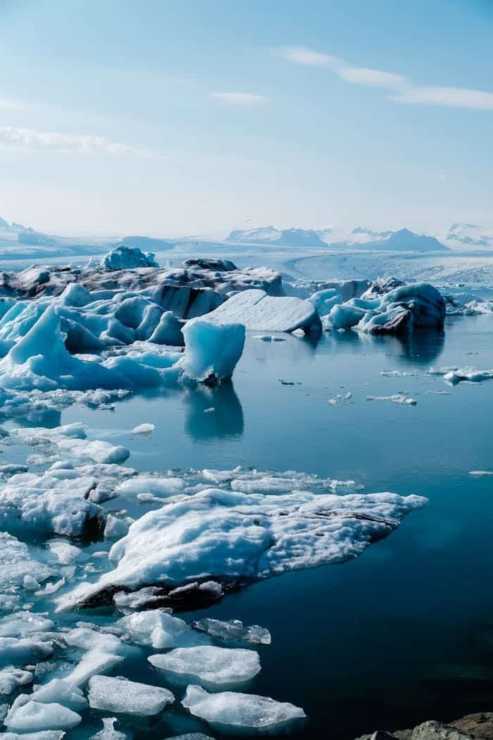 pexels-photo-20582197 Peaceful icebergs floating in the clear blue waters of Jökulsárlón Lagoon, Iceland.